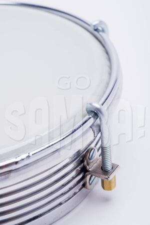 Close up view of aluminum tamborim by IVSOM, grooved shell and white plastic drum head.
