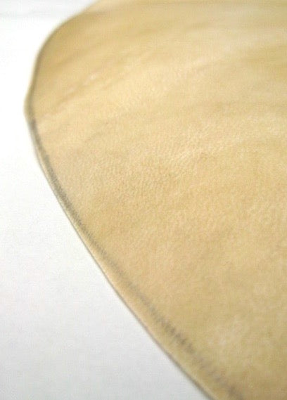 Close up view of goat skin drum head, no hoop, just plain goat skin. Use these heads on wooden alfaia drums.