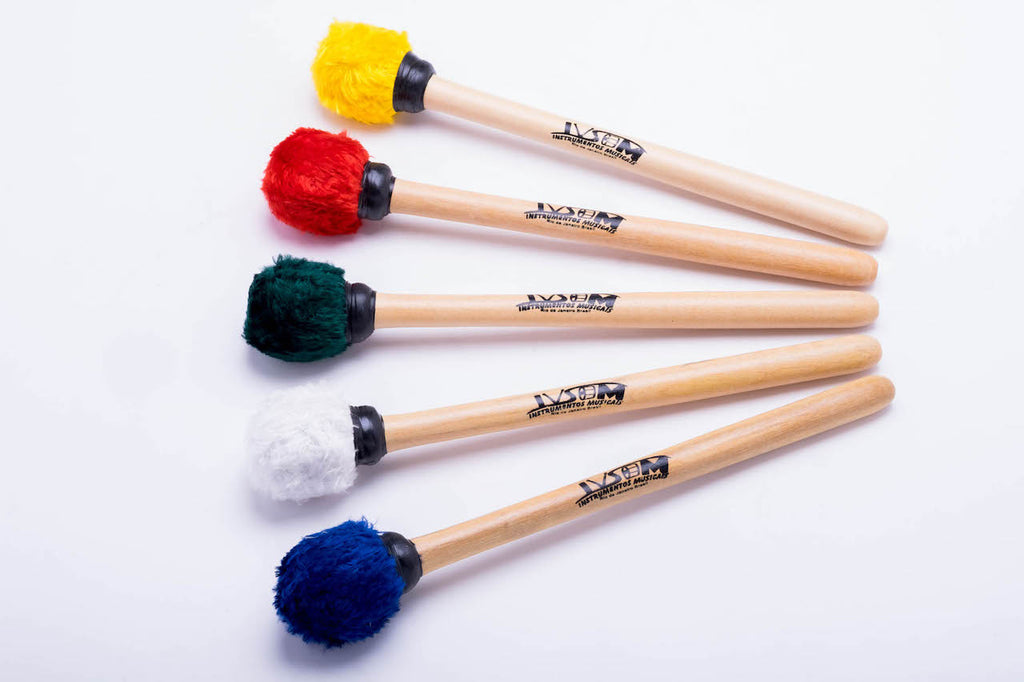 First and second surdo mallets, primera mallets in multiple colors. Wooden handles and fuzzy head mallets.