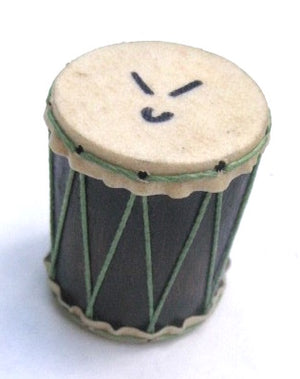 Small drum shaped shaker that has goat skin heads and green strings on a dark wooden shell. White background.