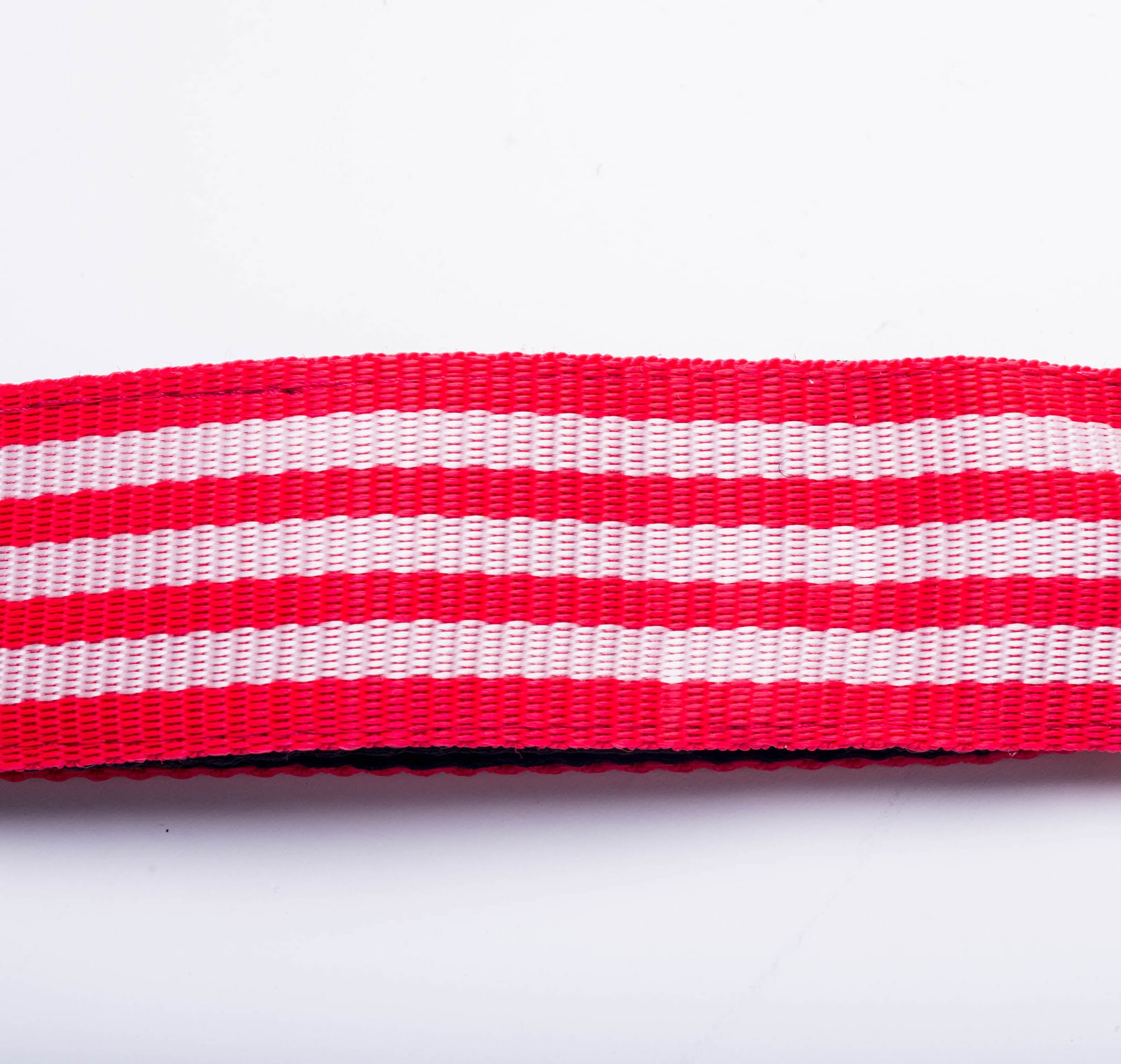 View of red and white samba strap material made by Macapart. 