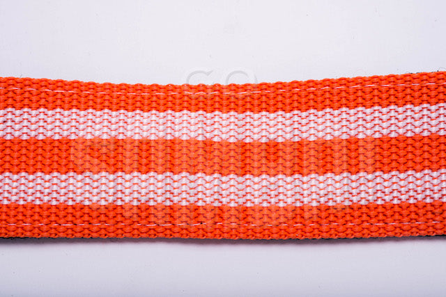 Orange and white material of a samba strap, on white background.
