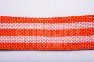 Orange and white material of a samba strap, on white background.